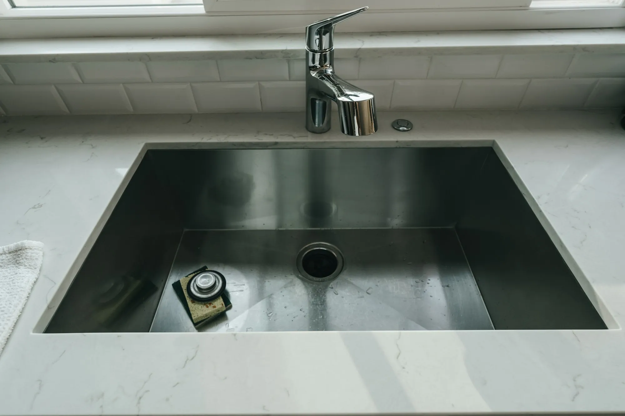 Clean stainless kitchen sink and faucet