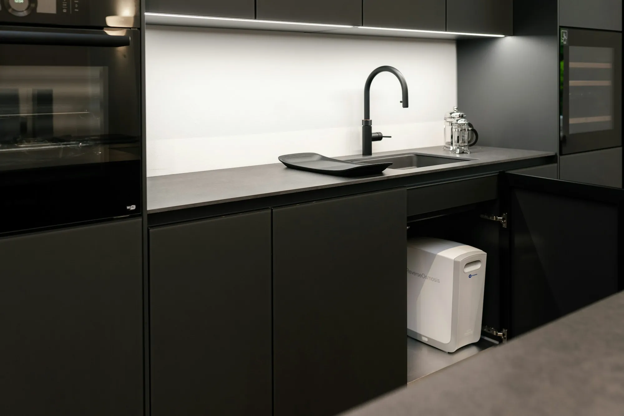 Modern dark kitchen with a drinking-water faucet