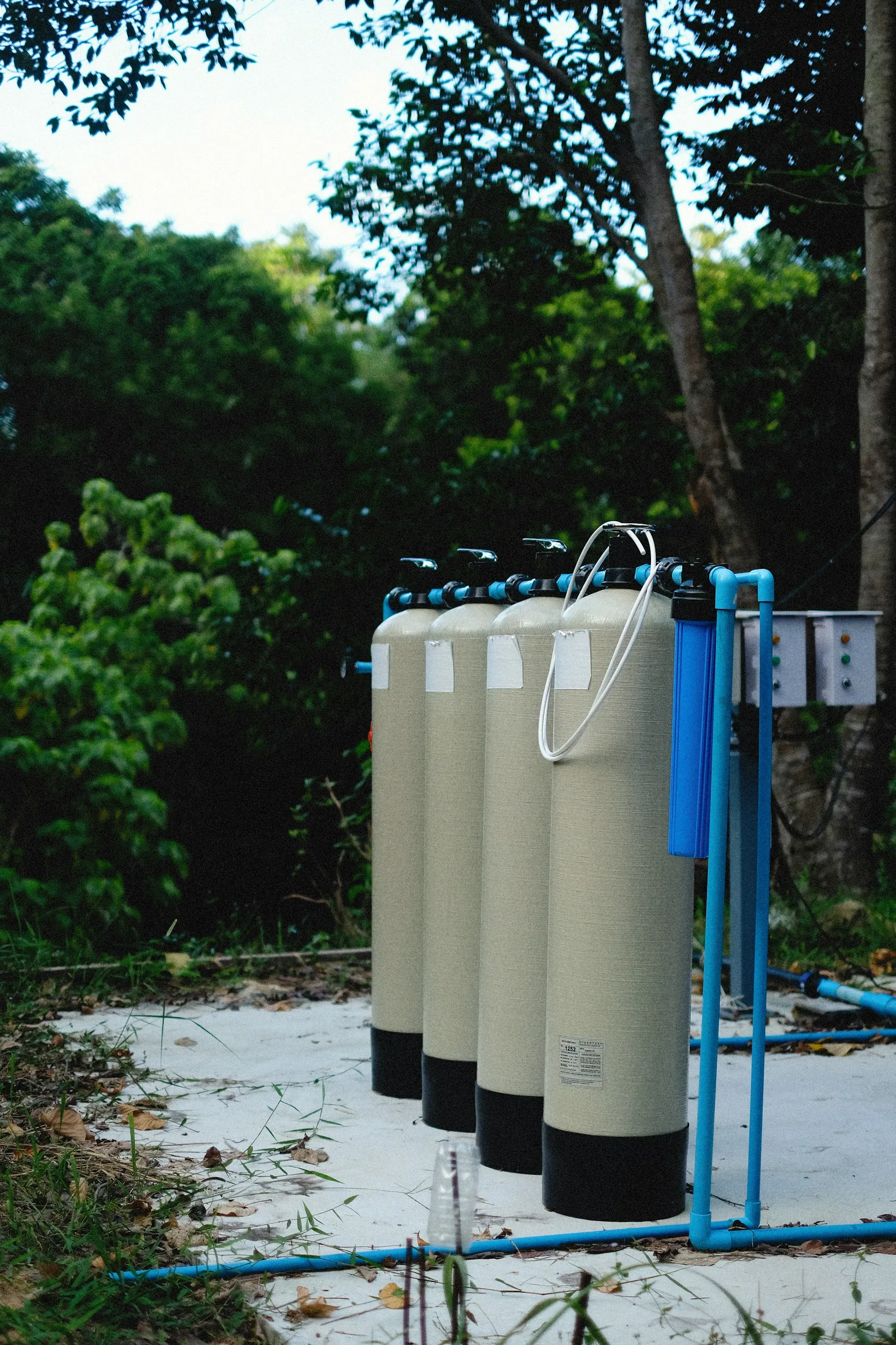 Water treatment tanks installed beside a house